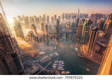 Dubai Marina with colorful sunset in Dubai, United Arab Emirates Royalty-Free Stock Photo #709870225