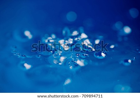 water drop close up / blue color  / abstract background

