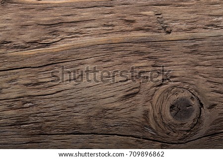 Wooden burned rustic texture for background. Rough weathered wooden board.