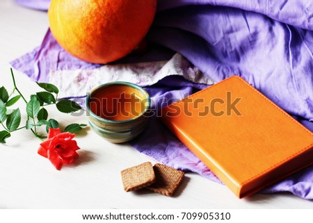 A cup of tea or Tea break, good morning, planning process, make notes, new day background, table space background, Orange, Pumpkin and rose, Tea cup