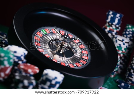 high contrast image of casino roulette, green light