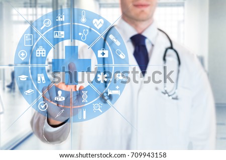 Medical doctor touching AR futuristic computer interface with concept about health care services, hospital background