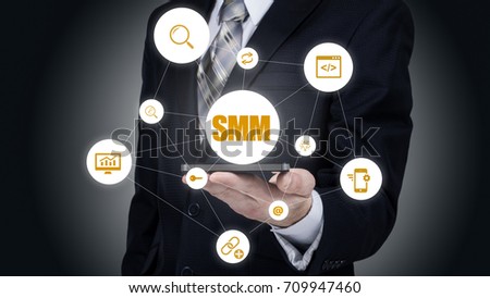 Business, technology, internet and networking concept. SMM - Social Media Marketing on the virtual display.
