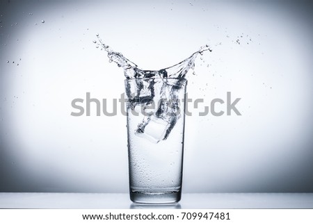 water splash in glasses isolated on white.