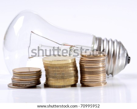 Color photograph of electric lamps and coins
