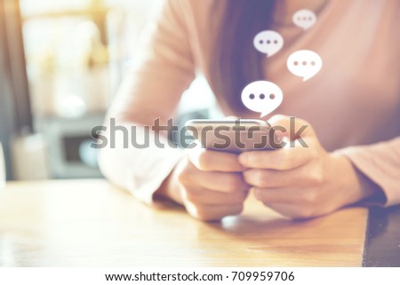 women's hand typing on mobile smartphone, Live Chat Chatting on application Communication Digital Web and social network Concept. Royalty-Free Stock Photo #709959706