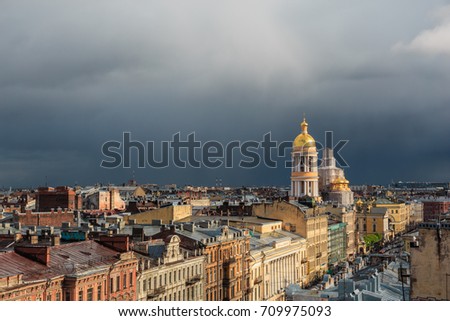Saint Petersburg panoramic view from rooftop at downtown houses of old town and church in cloudy day