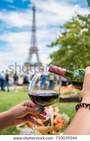 Pouring wine is the big glass at the Trocadero place with the Eiffel tower view in Paris