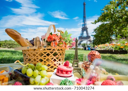 Picnic in Paris with wine, fruits and different french tasty dishes 
