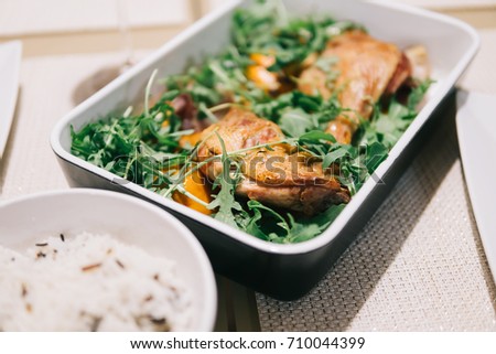 Cooked Duck Legs In Oven With Rocket Salad And Citrus Sauce