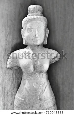 The statue made of sandstone. This image was blurred or selective focus. Black and white picture.