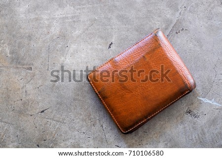Old wallet texture on concrete floor background. empty purse with nobody.