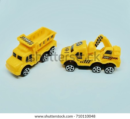Yellow toy car on white background.