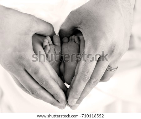 Newborn feet hands heart