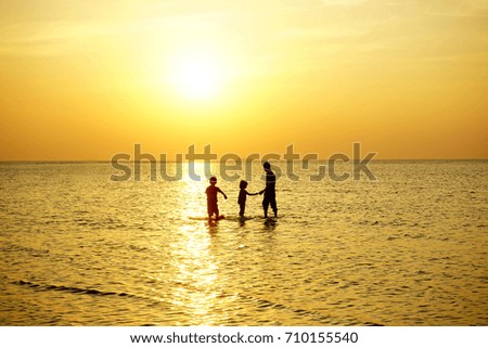 silhouette of happy family spending time together during sunset