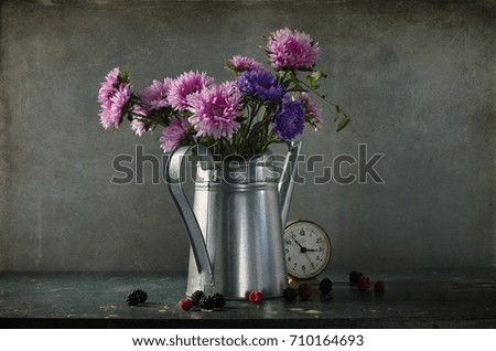 aster bouquet in a watering-can