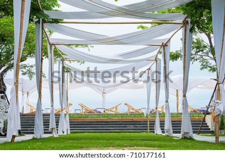 Wooden arch with beautiful location and Beach chair, landmark of Huahin Thailand.