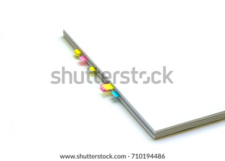 white book with color bookmarks 