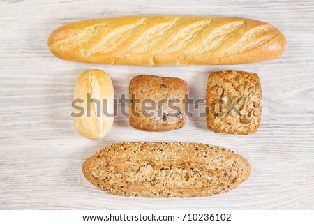 Different kind of breads on a wooden table