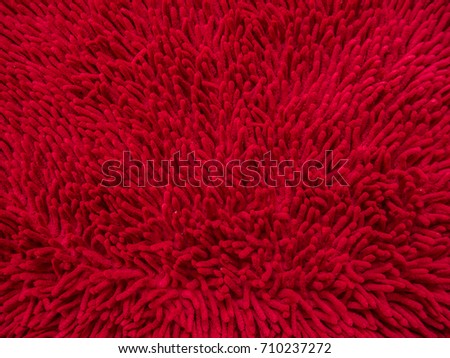 Background of red carpet or foot scraper, close up image