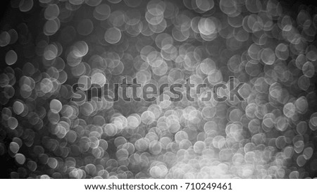 Silver lights bokeh defocus abstract background. Silver Festive Christmas. Glitter twinkled bright background.