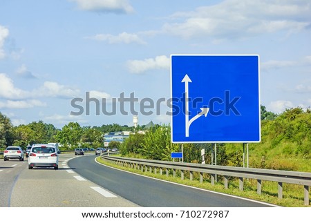 highway with empty signboard (german autobahn) with cars