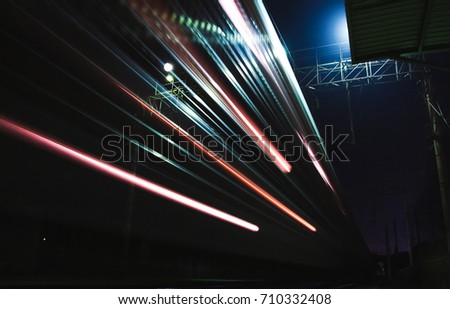Trains in motion on long exposure at night
