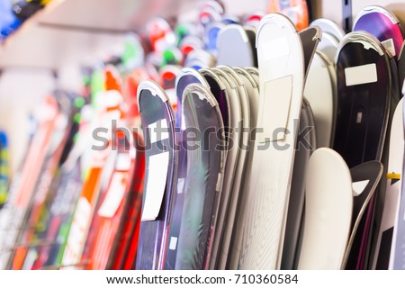 Image of large selection of skis in store.