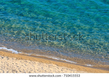 Beautiful sea surf, summer seascape view from sandy beach.