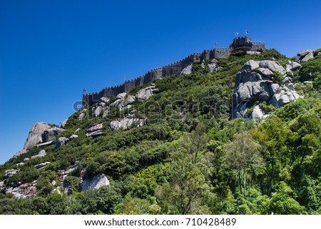 The hill with Arabian moorish castle on the top. Summer picture with blue sky. Sintra, Portugal.
