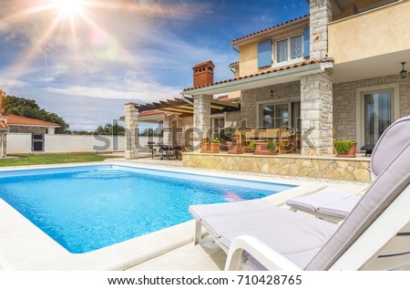 Holiday house with pool Royalty-Free Stock Photo #710428765