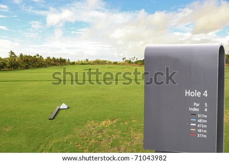 golf field with sign and room for text