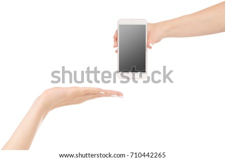 Female hand give over a mobile phone smartphone on a white background isolation