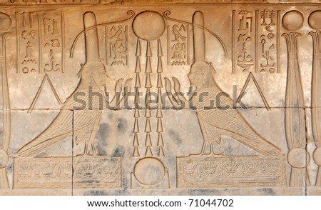 Two ba-birds under the sun representing the manifestation of a deceased person's soul at the ancient Egyptian fertility and love temple of the goddess Hathor at Dendera, in Egypt