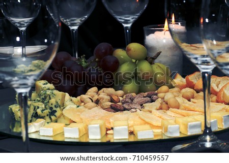 Mix cheese on wooden board with grapes