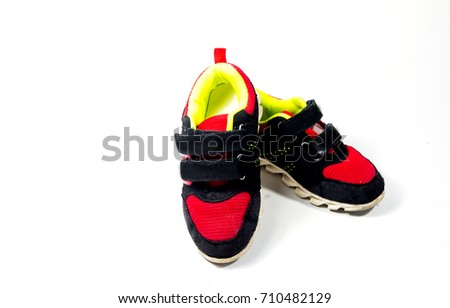 Children's colorful shoes used. On a white background.
