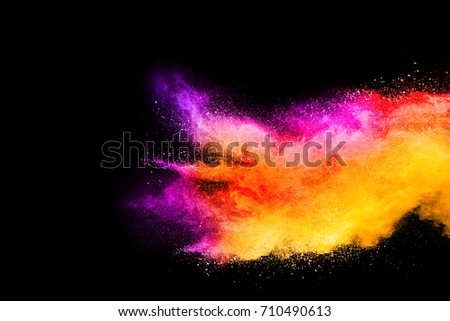 Launched colorful powder on black background or Color powder explosion on black background. Mauve color cloud. color dust explode. Freeze motion paint Holi. Royalty-Free Stock Photo #710490613