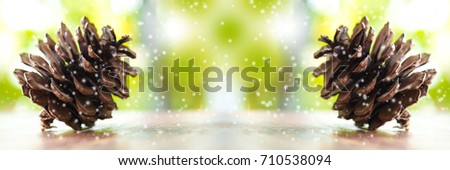 Christmas trees and merry christmas word. Close up Pine cones and green natural background. Decoration Banner