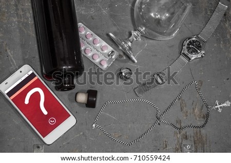 A set of subjects: A smartphone with a question mark on the display, tablets, drunk alcohol, a man's watch, a chain leaning an infinity sign. Everything lies on an old wooden background
