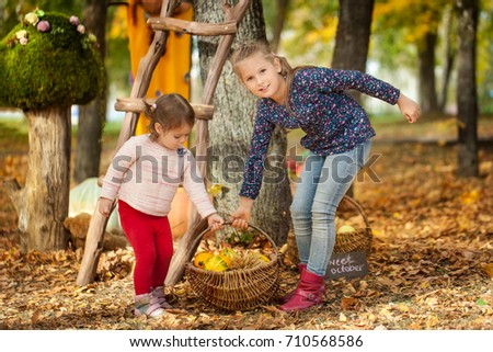 Two girls in the autumn park