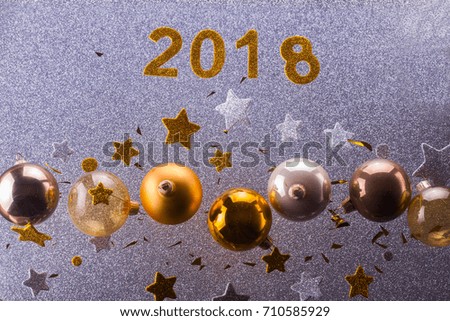 Silver and golden christmas bubbles and stars with 2018 new year sign