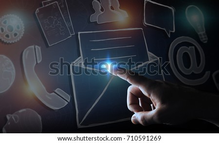 Businessman on blurred background touching manuscript email icon with his finger