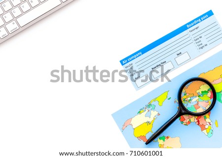 booking trip with map, tickets and tourist outfit on white office desk background top view mockup