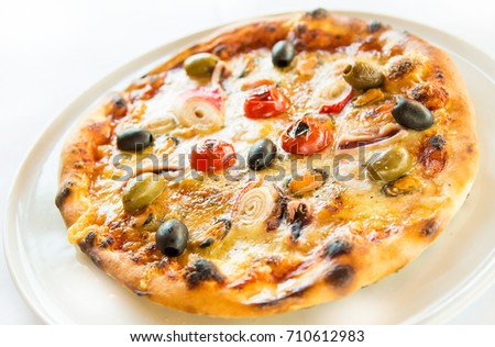 Frutti di Mare seafood pizza low angle shot with shallow focus and visible detail ingredients