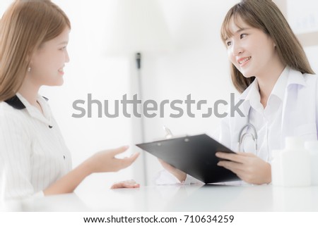 Doctor explaining diagnosis to her female patient. Asian people