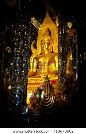Gold Buddha statues in the glass sanctuary