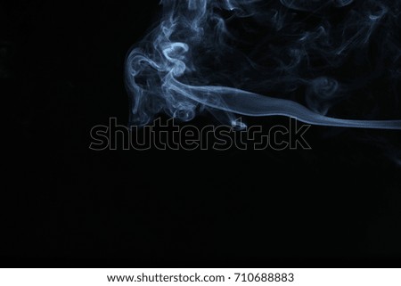 White smoke on black background.