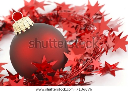 Close-up of red ball and stars on white background