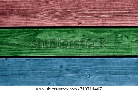Wooden background painted in the colors of RGB.