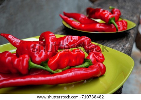 red hot peppers on green plate